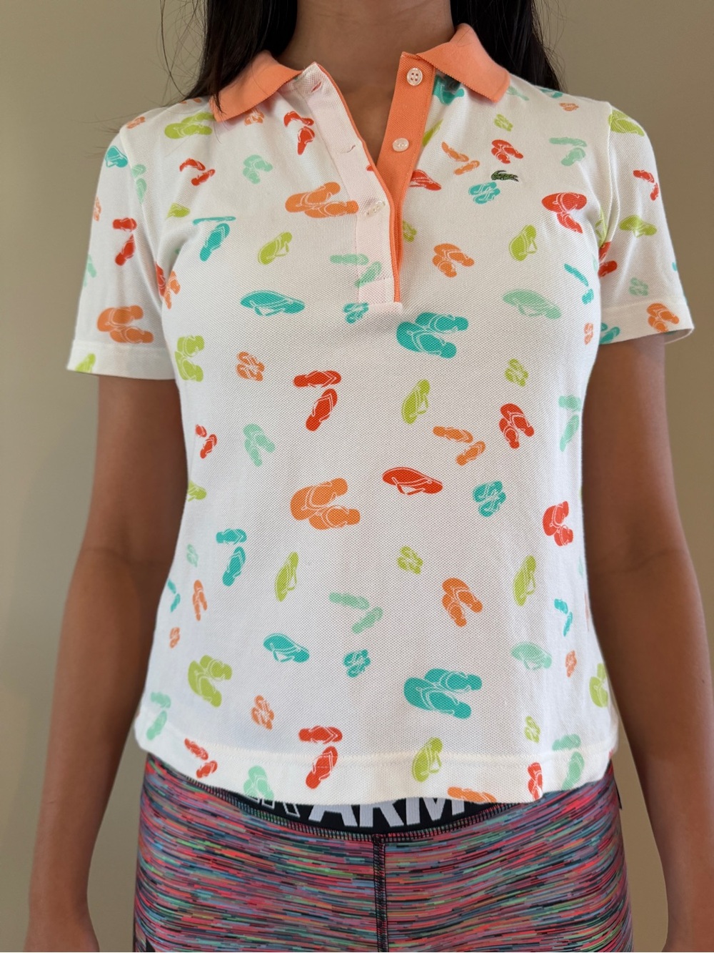 Lacoste White Polo with Coral Collar and Multicolor Flip‑Flop Print